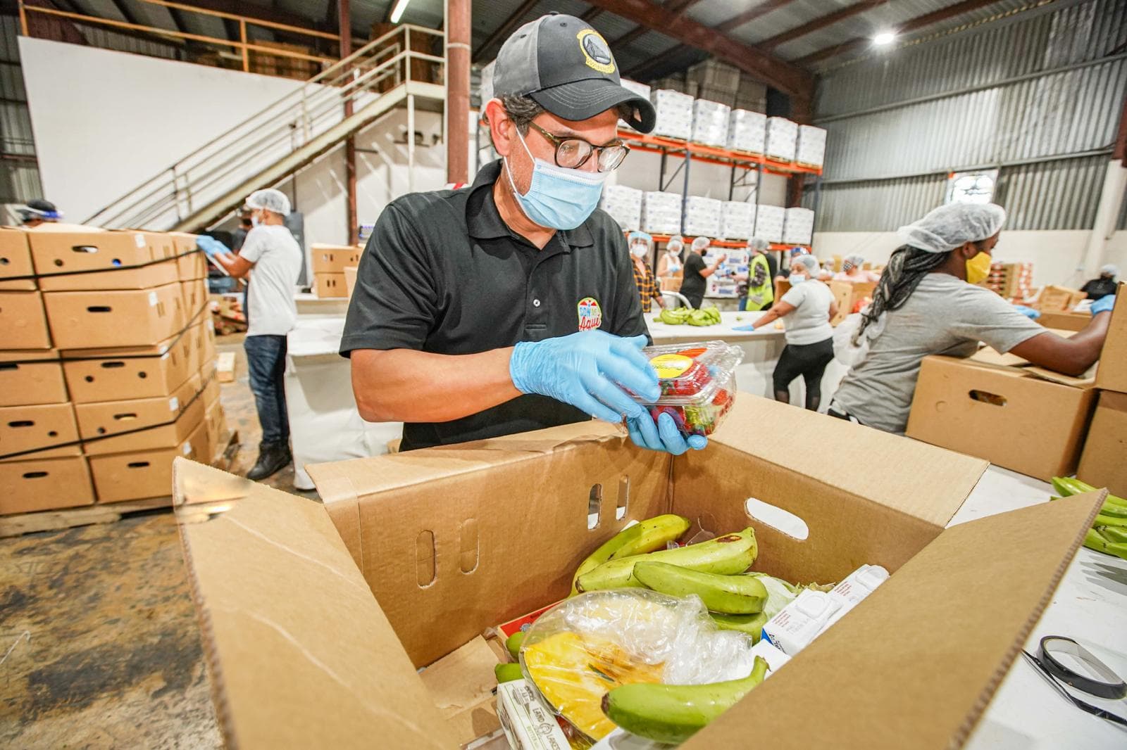Smiling recipient with food box